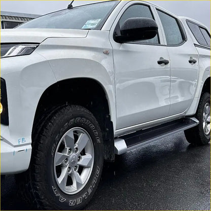 White mitsubishi triton double cab with black OEM style side step running board and silver alloy wheels 2019-2023