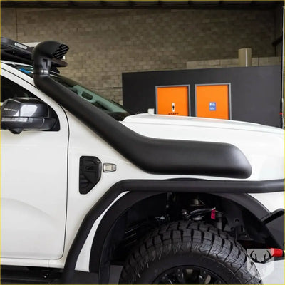 Black rubber snorkel tube mounted on white ford ranger nex gen pickup truck for offroad use