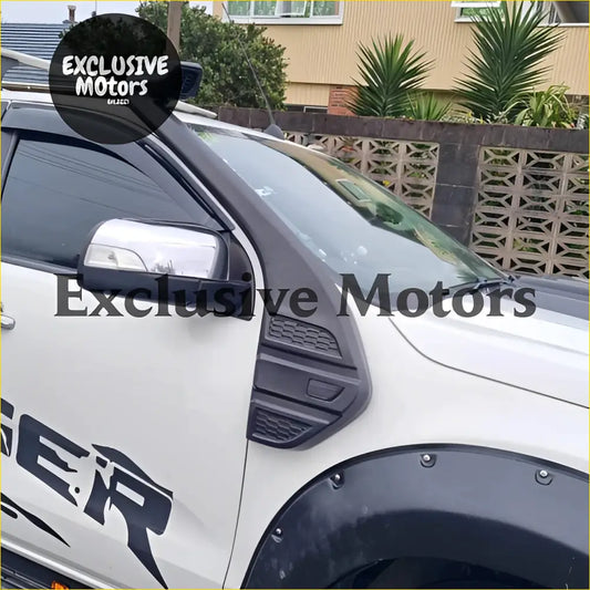 White ford ranger pickup with black fender flares and side mirror showing snorkel kit for px2 px3 2016-2021