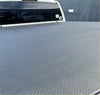 Gray textured truck bed liner with diamond plate pattern on back side of soft tonneau cover for ford ranger 2022+ double cab