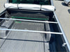 Silver metal bed rack with two horizontal bars installed in truck bed for soft tonneau cover mitsubishi triton double cab back side view