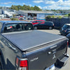 Black soft tonneau cover for mitsubishi triton 2024 double cab with textured surface and sleek modern design back side view