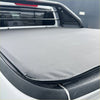 Gray textured soft tonneau cover with black trim and stitched edges for nissan navara np300 2015-2020/navara 2021+ truck bed