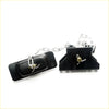 Black plastic livestock leg trap with silver metal chain and adjustment mechanism for mazda b series spare tire carrier back side