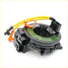 Black plastic airbag pretensioner with yellow wiring and orange connectors on back side of spiral cable clock spring for mitsubishi delica d5