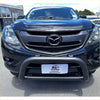 Black mazda bt50 pickup truck with stainless steel matte nudge bar and rugged front bumper guard medium size