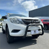 White mazda bt-50 pickup truck with a matte black stainless steel nudge bar and black front bumper guard