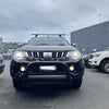 Black mitsubishi triton with a matte stainless steel nudge bar and chrome grille for 2015-2018 models