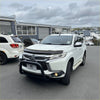 White mitsubishi triton pickup with black bumper guard and chrome accents featuring a matte stainless steel nudge bar