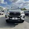 Silver toyota hilux pickup with matte stainless steel nudge bar medium size black bumper guard and roof rack