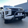 White mitsubishi triton pickup with a matte black stainless steel nudge bar and black front bumper guard