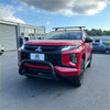 Red mitsubishi triton pickup with stainless steel medium size nudge bar black bumper guard and roof rack