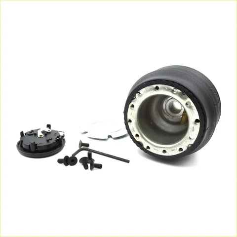 Black rubber steering wheel hub adapter with metallic inner ring and mounting hardware for nissan cefiro a31 1988-1994