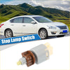 Gray and brown plastic stop lamp switch with yellow connector for Toyota Tacoma 4Runner 2005-2019 shown from back side