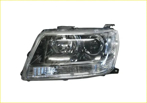 Clear plastic headlight assembly with chrome housing and dual circular lenses for suzuki grand vitara jt 2005-2012 left side