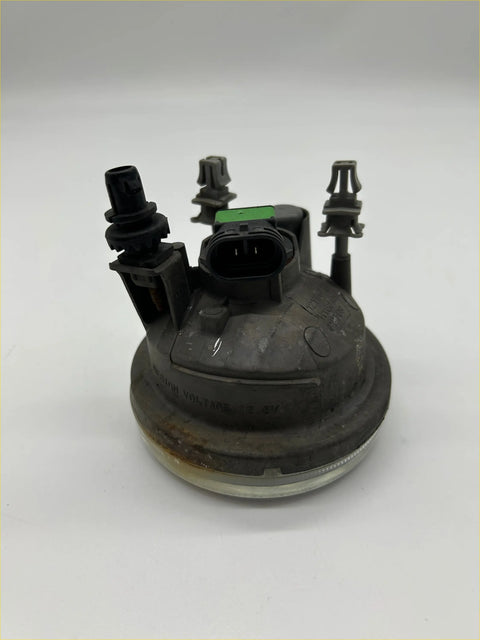 Back view of black plastic fog light for suzuki sx4 gya gyb left side with green connector and mounting tabs