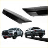 Black glossy plastic rear tailgate handle covers for Toyota Hilux Revo 2015-2023 back side view