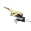 Yellowish metallic tail gate handle opener for nissan navara d21 1986-1997 with digital caliper measuring 5.05 mm