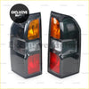 Black plastic tail light assembly for nissan patrol gu 2005-2016 with amber clear and red lenses back side view