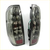 Pair of chrome finished aftermarket tail lights with clear lenses and red reflectors for nissan navara d40 2005-2015