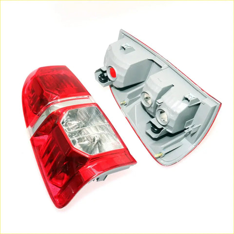 Tail light x2 for toyota hilux sr5 2004-2015 showing red and clear plastic assembly with silver trim back side view