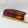 Black-framed tail lights with red and amber lenses for nissan datsun 720 ute 1982-1986 showing back side