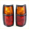 Black-framed tail lights with red and amber textured lenses for Nissan Datsun 720 Ute 1982-1986 back side view