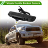 Black plastic tailgate handle backup camera with integrated lens and coiled cable for toyota tacoma 2005-2015 shown from back side