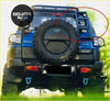 Back view of blue toyota fj cruiser with black spare tire and tailgate ladder for 2007 to 2022 models