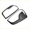 Black matte-finish side mirror cover trim for nissan navara 2021 plus st st-x pro 4x4 shown from the back side
