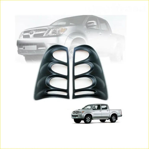 Black plastic side mirror housing covers for toyota hilux pickup trucks shown from the back in matte black finish