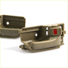 Tan plastic car door handle bezel set for toyota hilux mk6 sr5 showing back side with red button on latch mechanism