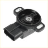 Black plastic throttle position sensor with metallic internal part and two mounting tabs for toyota trucks
