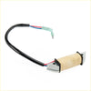 Tohatsu nissan exciter coil assy with black wire red blue leads and green connector on beige insulated stator coil
