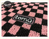 Pink and black checkered car floor mat with tomu brand patch from Tomu Sakura pink checker floor mats collection