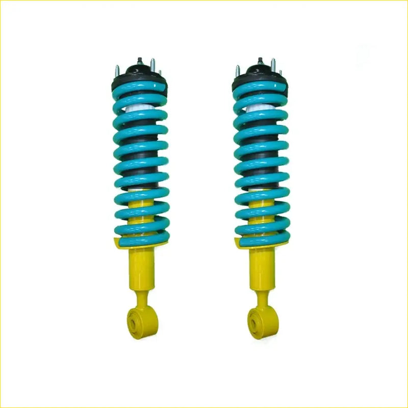 A pair of turquoise and yellow coil-over suspension shocks with black mounts for Toyota Hilux N70 Dobinsons Nitro Gas