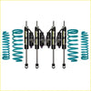 Set of four black pro comp shocks with teal coil springs for toyota landcruiser 105 series from dobinsons