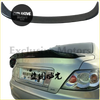 Carbon fiber rear trunk spoiler on the back side of a silver toyota mark x sedan