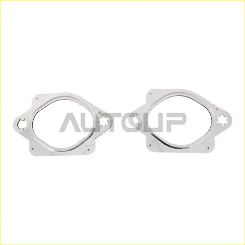 Silver metallic exhaust manifold gasket set with circular opening and four holes for ford f 150 turbo install