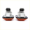 A pair of amber plastic turn signal lights with gray connectors and black gaskets for toyota hilux 1997 to 2005