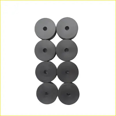 Black circular universal 1 inch polyethylene body lift blocks 70mm dia x 25mm high x 10mm hole arranged in grid