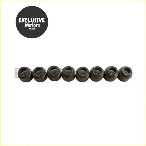 Eight black metallic valve stem oil seals arranged in a row for mazda e2200 bus and b2200 pickup engines
