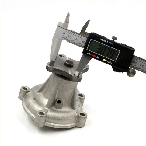 Silver metallic water pump for datsun nissan pulsar 310 engine measured 30.79 mm with digital caliper