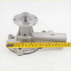 Silver metallic water pump with cylindrical body and flanged top for nissan datsun ute 520 to 720 1965-1986