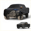 Black waterproof all weather truck cover with orange accents for toyota tacoma 2016-2023 shown from back side