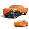 Bright orange durable waterproof all weather fabric car cover snugly fits dark gray toyota tundra 2014-2023