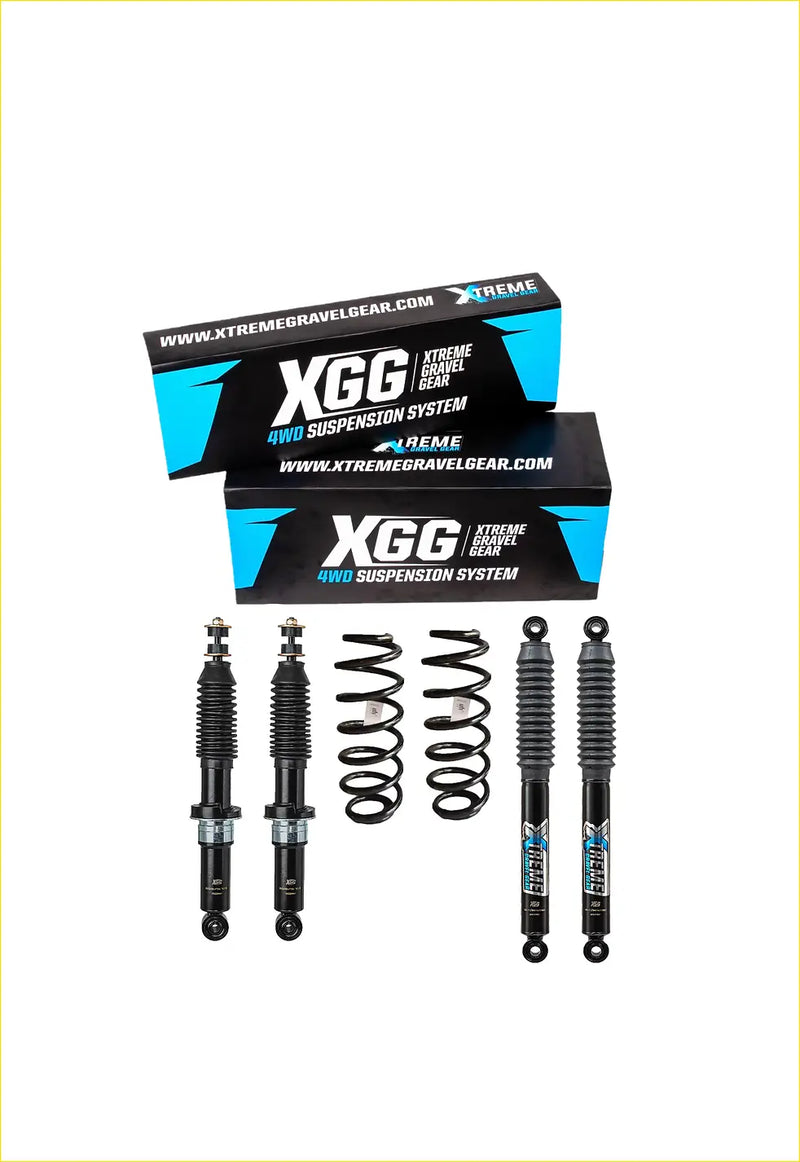 Black xgg 4wd suspension system with coiled springs and shocks displayed in front of mountain series packaging