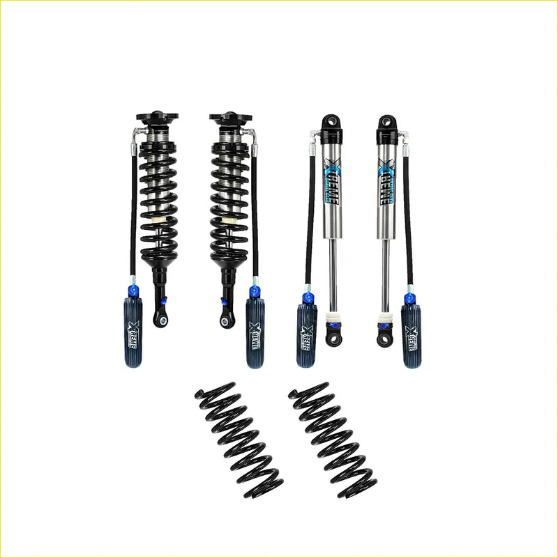 Set of four black silver xrex shock absorbers with blue accents and two black coil springs for toyota hilux n80 wide lift kit