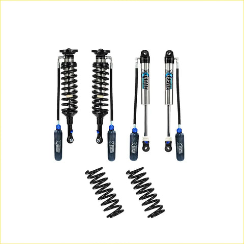 Set of four black and silver xrex shock absorbers with blue accents and two black coil springs for jeep wrangler jl lift kit